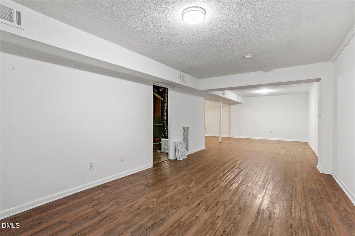 2000 Waters Drive Raleigh, NC 27610 - Photo 16 of 20 a view of empty room with wooden floor