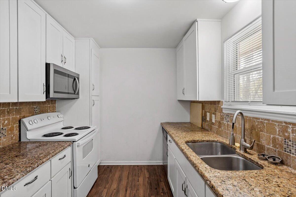 2000 Waters Drive Raleigh, NC 27610 - Photo 4 of 20 a kitchen with a sink stove and microwave