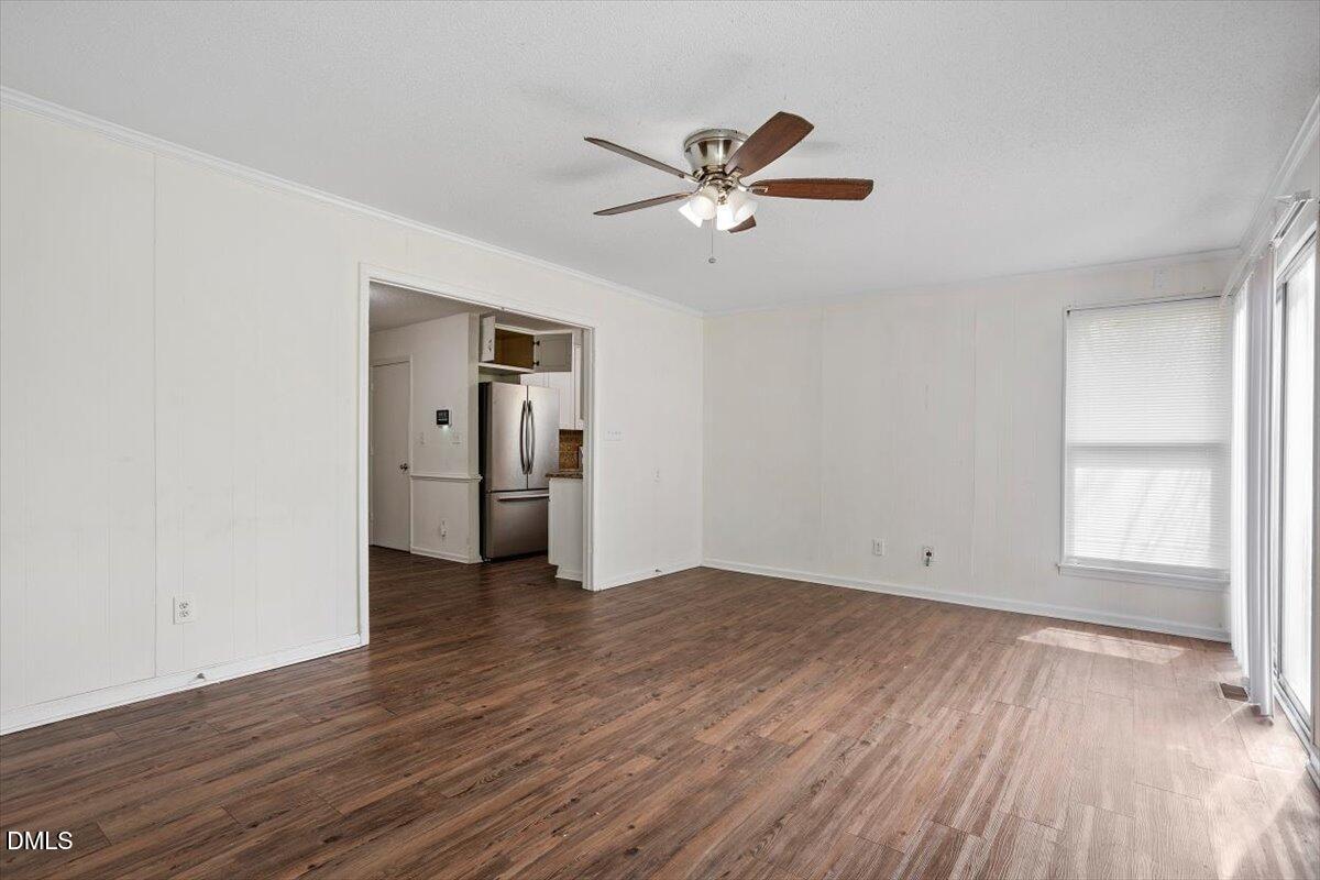 2000 Waters Drive Raleigh, NC 27610 - Photo 6 of 20 a view of empty room with wooden floor and window