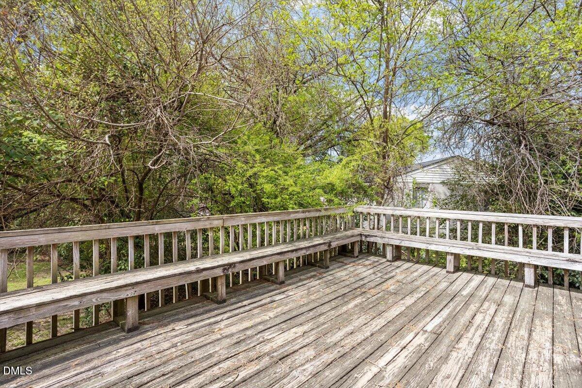 2000 Waters Drive Raleigh, NC 27610 - Photo 9 of 20 a view of a wooden deck with a yard
