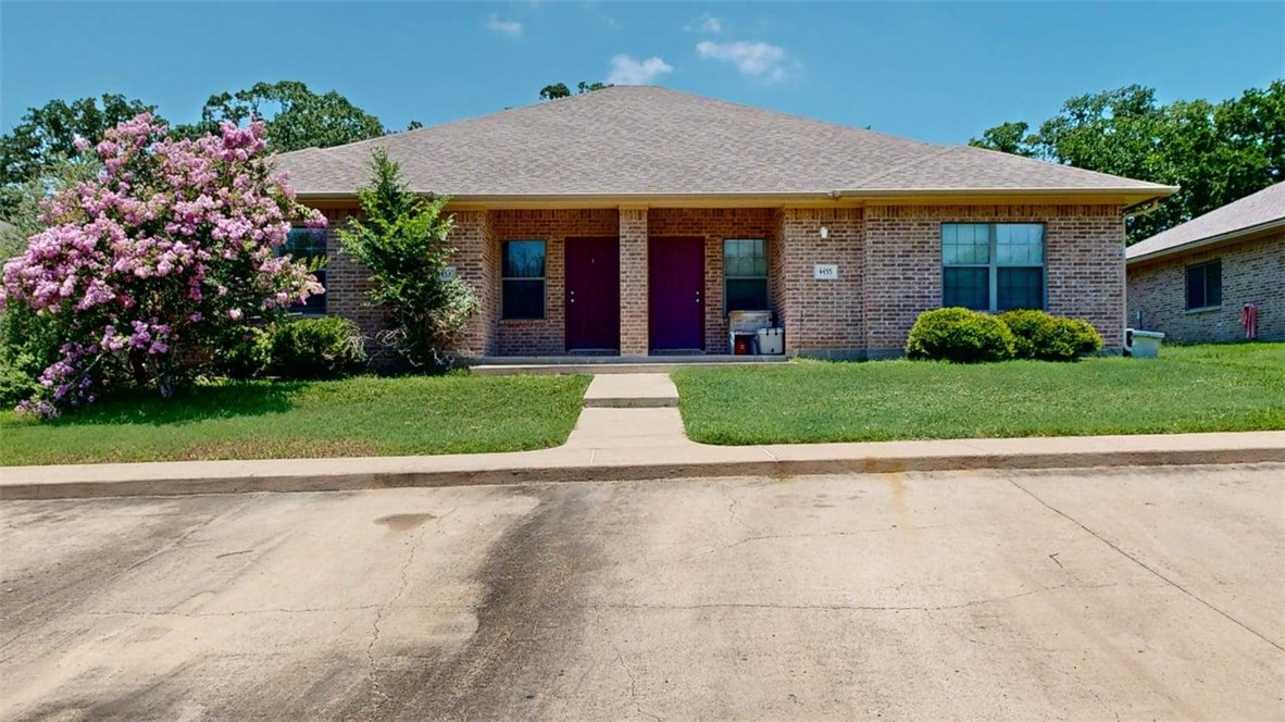 a view of a house with a garden