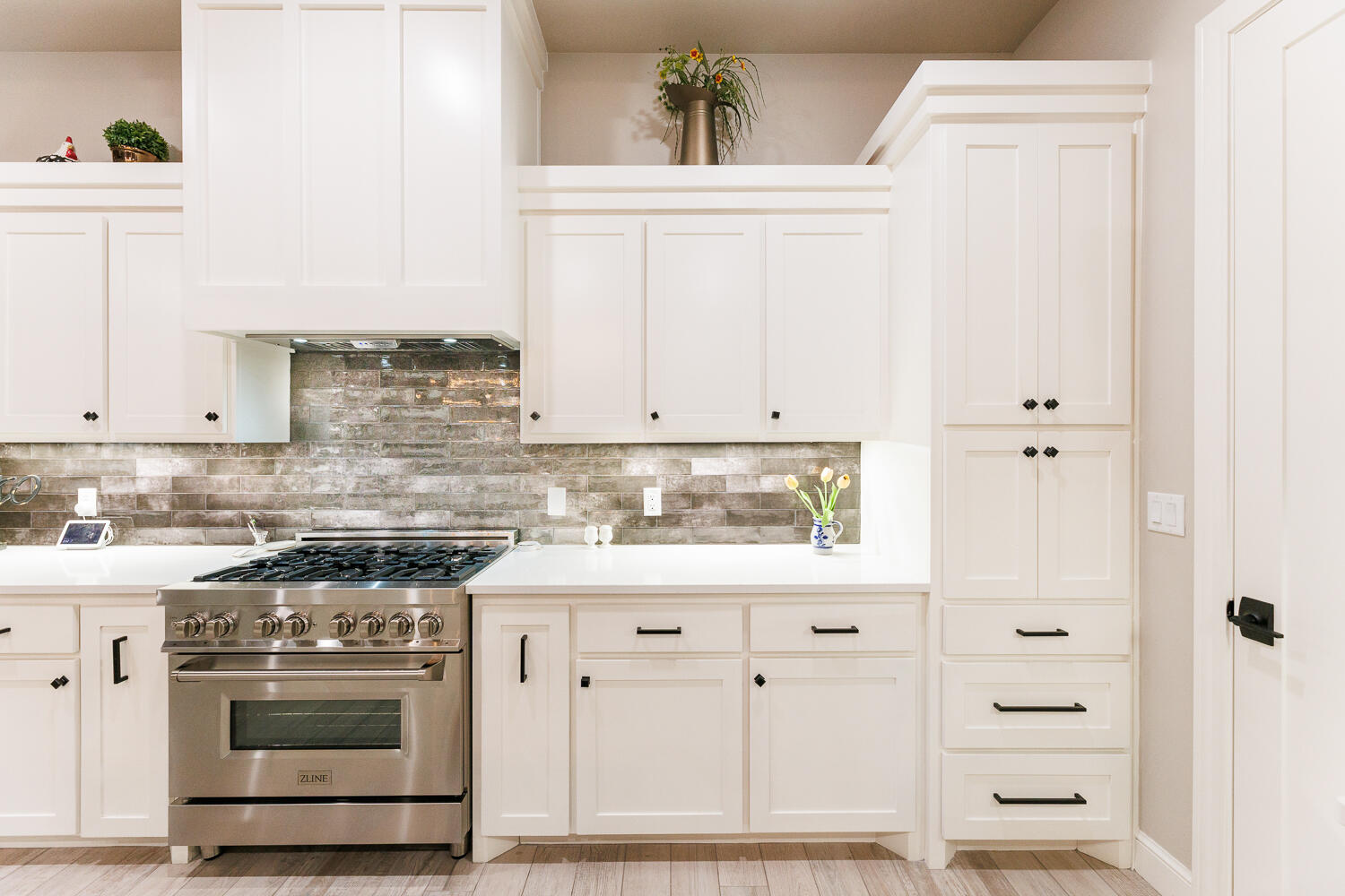 5310 112th Street Lubbock, TX 79424 - Photo 11 of 36 a kitchen with stainless steel appliances granite countertop a sink and a stove
