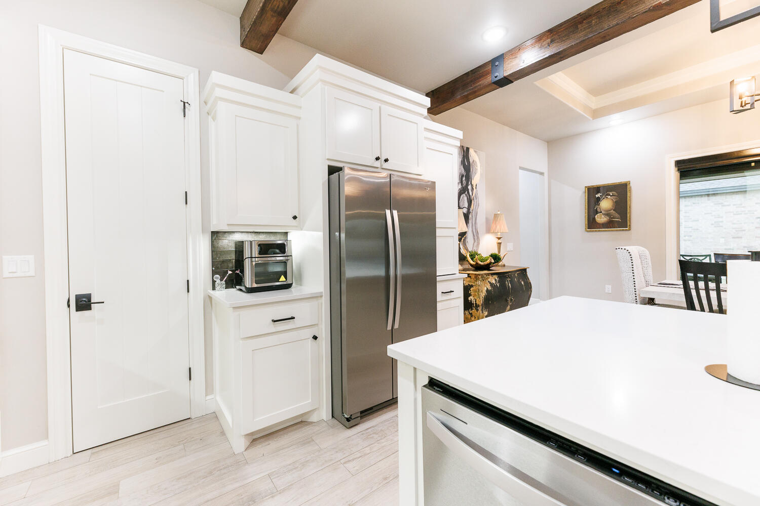 5310 112th Street Lubbock, TX 79424 - Photo 12 of 36 a kitchen with a refrigerator and a sink