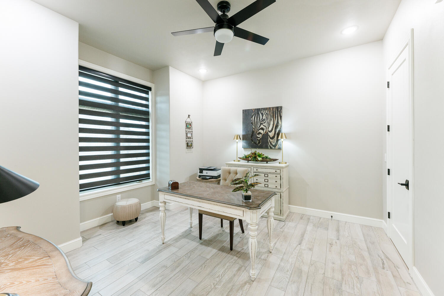 5310 112th Street Lubbock, TX 79424 - Photo 21 of 36 a living room with furniture and a wooden floor