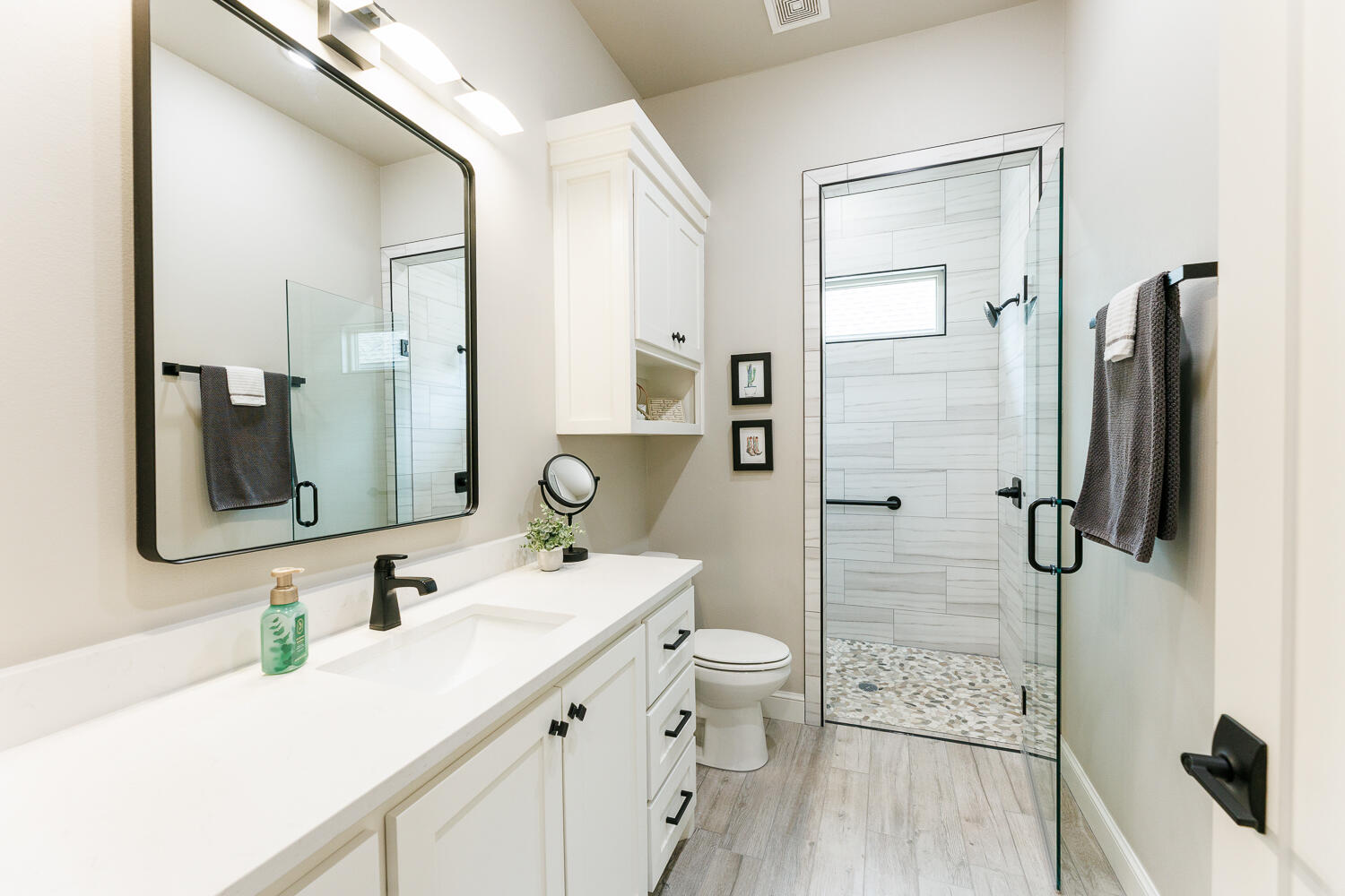 5310 112th Street Lubbock, TX 79424 - Photo 24 of 36 a bathroom with a granite countertop sink toilet and shower