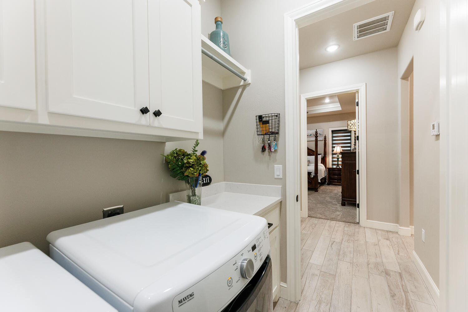 5310 112th Street Lubbock, TX 79424 - Photo 29 of 36 a room with a white bed and cabinets