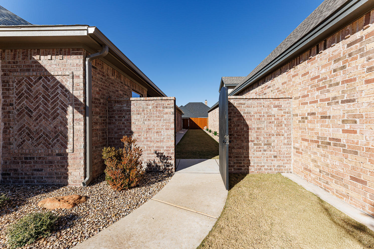 5310 112th Street Lubbock, TX 79424 - Photo 35 of 36 a pathway of a house with a street