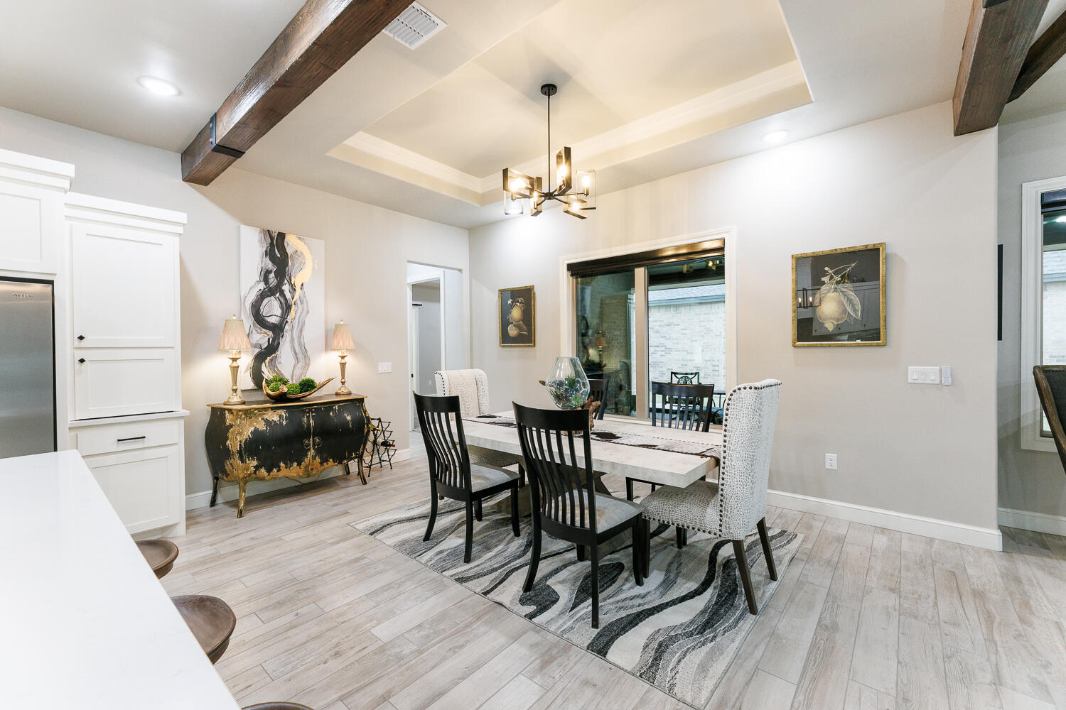 5310 112th Street Lubbock, TX 79424 - Photo 6 of 36 a view of a dining room with furniture window and wooden floor