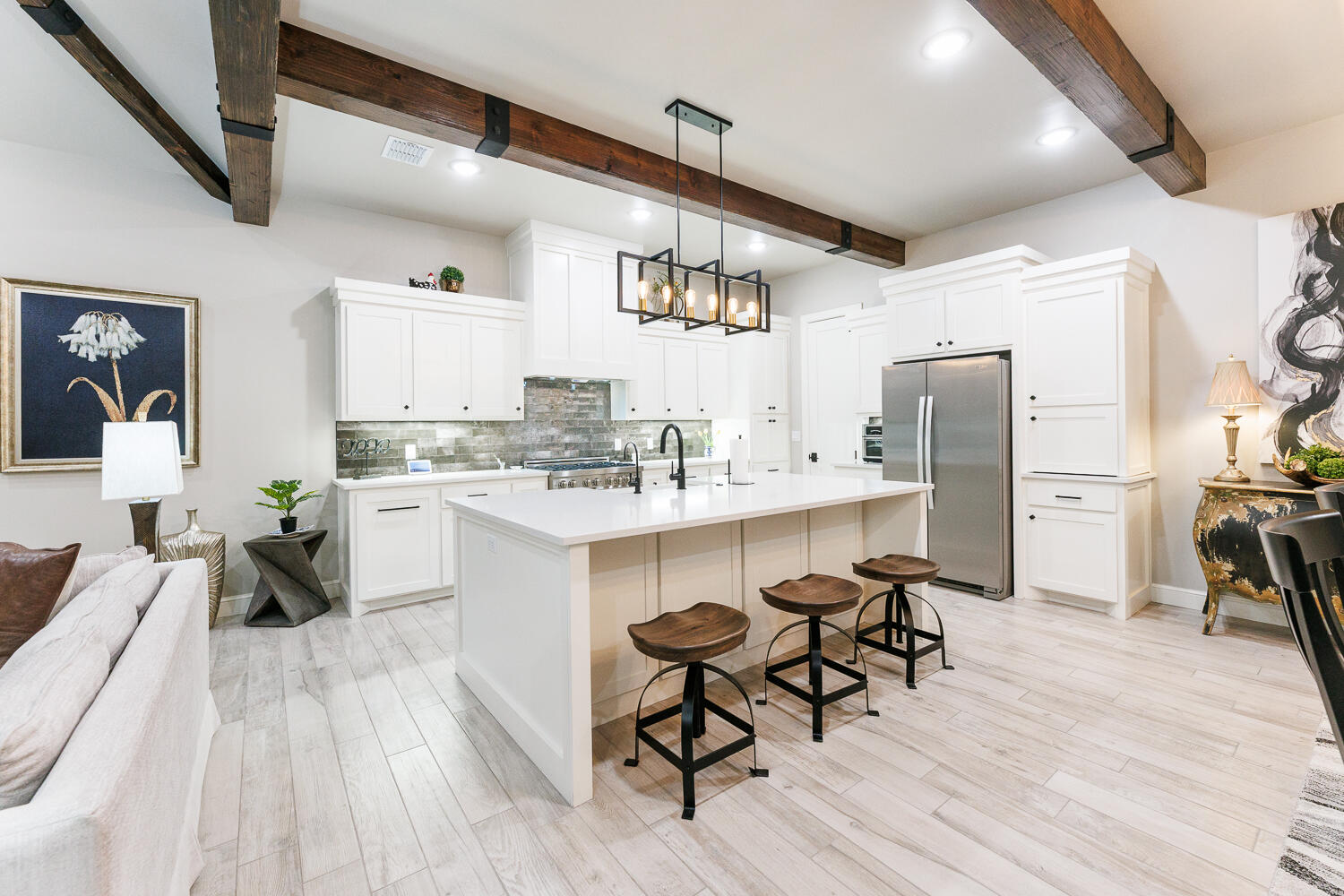 5310 112th Street Lubbock, TX 79424 - Photo 7 of 36 a large white kitchen with lots of counter space a sink appliances and cabinets