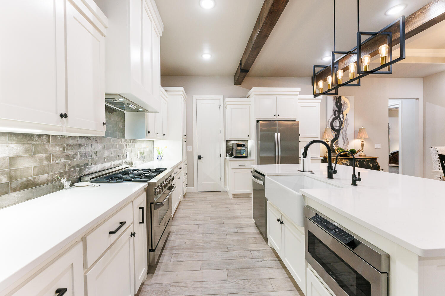 5310 112th Street Lubbock, TX 79424 - Photo 9 of 36 a large white kitchen with stainless steel appliances