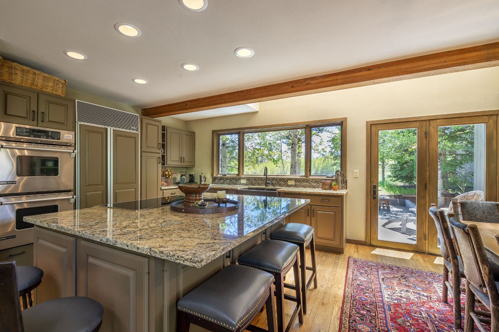 118 Topaz Road Silverthorne, CO 80498 - Photo 10 of 34 Three decks are accessed from the kitchen/dining area patio doors