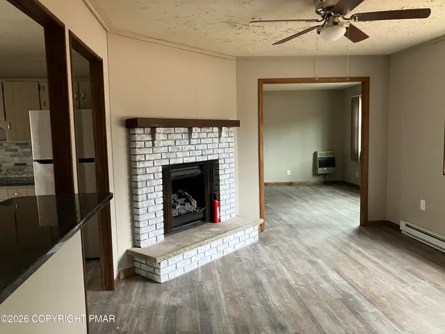 a living room with a fireplace