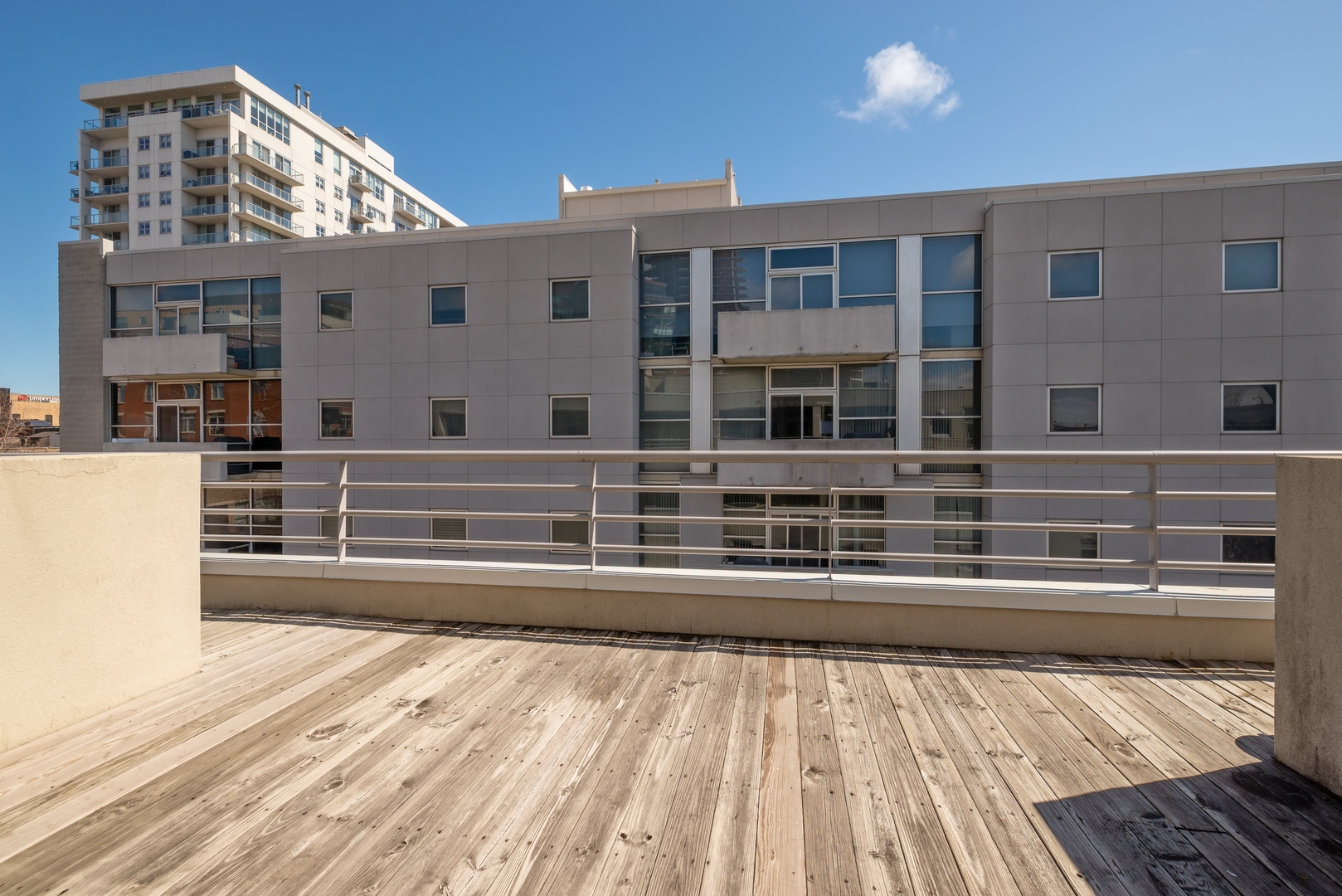 943 West Huron Street, Unit E Chicago, IL 60642 - Photo 9 of 12 a view of a building from a balcony
