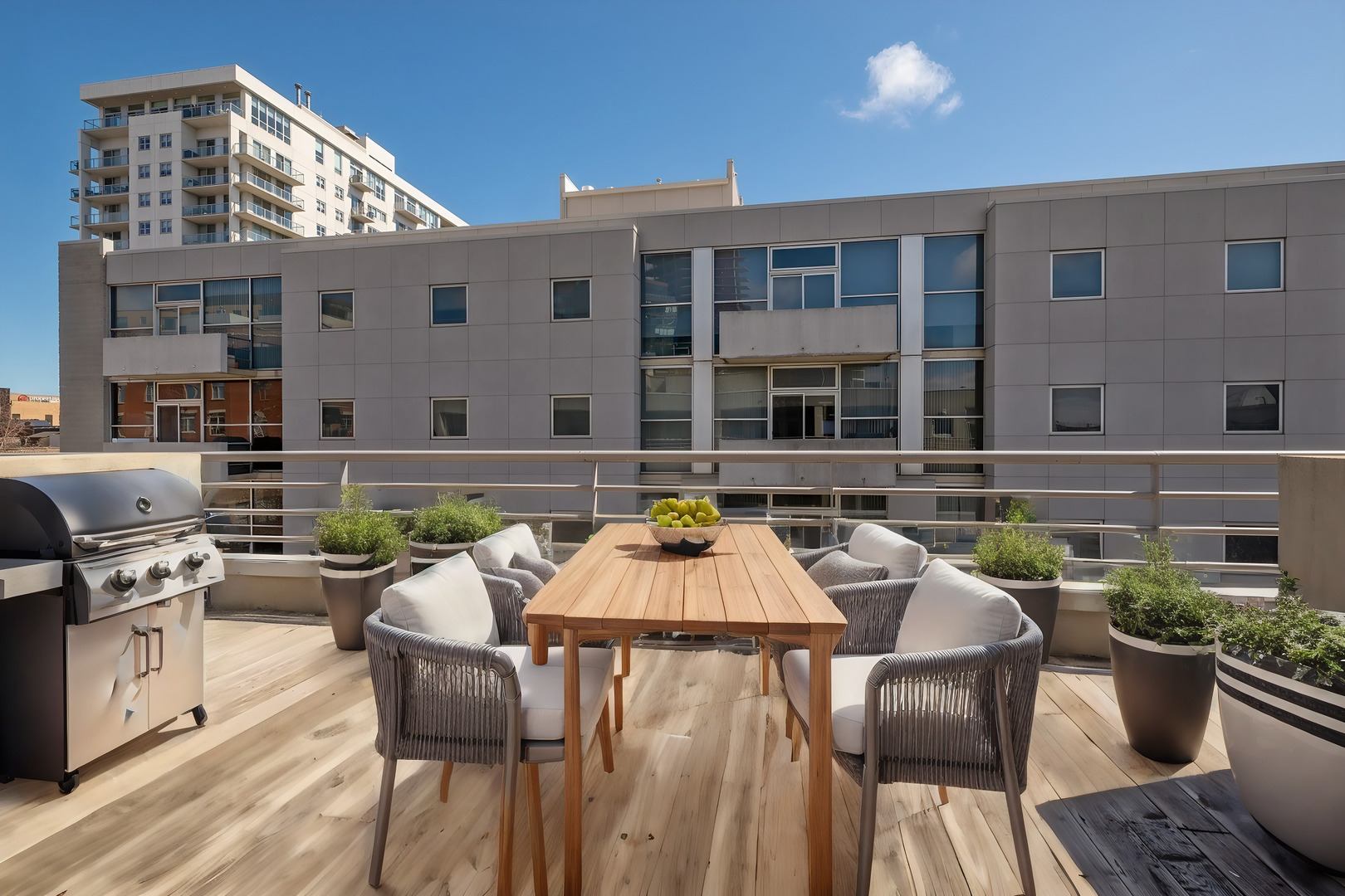 943 West Huron Street, Unit E Chicago, IL 60642 - Photo 10 of 12 a view of a patio with table and chairs and potted plants