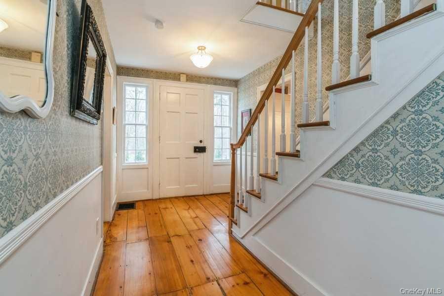 1141 Beekman Road Hopewell Junction, NY 12533 - Photo 13 of 36 a view of front door and wooden floor