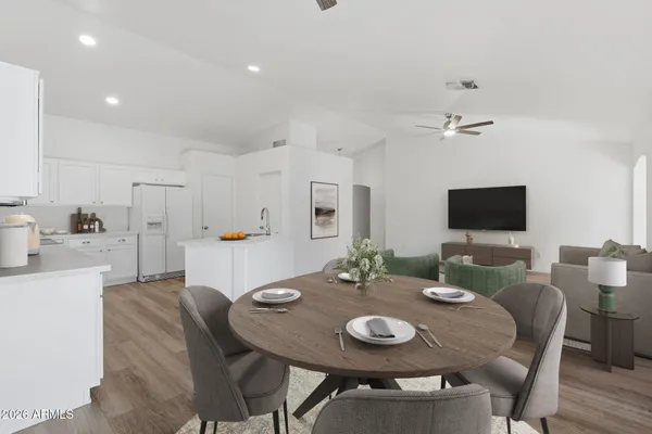 a view of a dining room with furniture and wooden floor