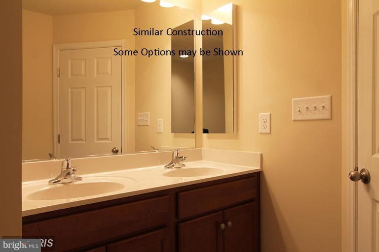 0 Rumbling Rock Road Hedgesville, WV 25427 - Photo 13 of 26 a bathroom with a sink and a mirror