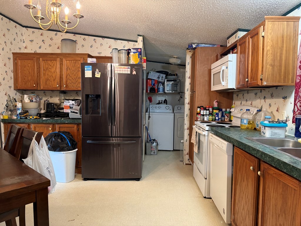 920 Pioneer Road Grimsley, TN 38565 - Photo 11 of 15 a kitchen with stainless steel appliances granite countertop a refrigerator and a sink