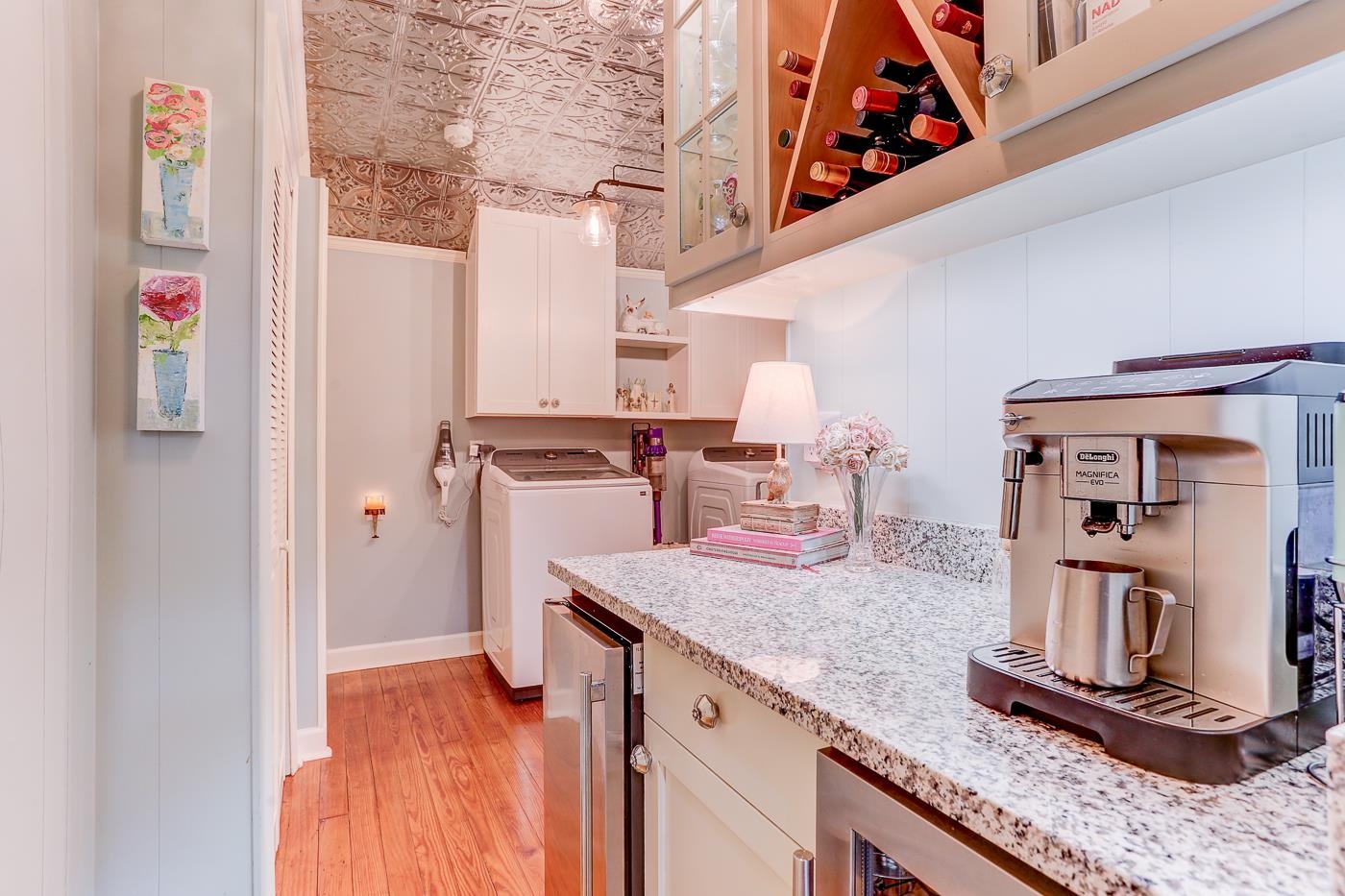 450 South Goodlett Street Memphis, TN 38117 - Photo 15 of 37 Kitchen featuring an ornate ceiling, washer / dryer, open shelves, decorative light fixtures, and glass insert cabinets