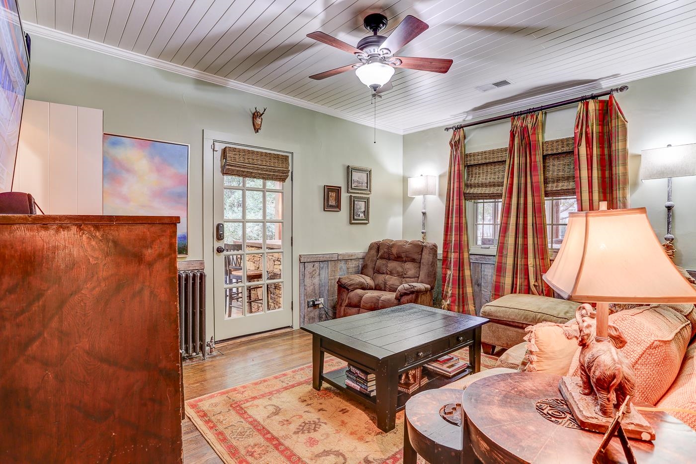450 South Goodlett Street Memphis, TN 38117 - Photo 17 of 37 Living room with crown molding, wood ceiling, radiator, wood finished floors, and ceiling fan