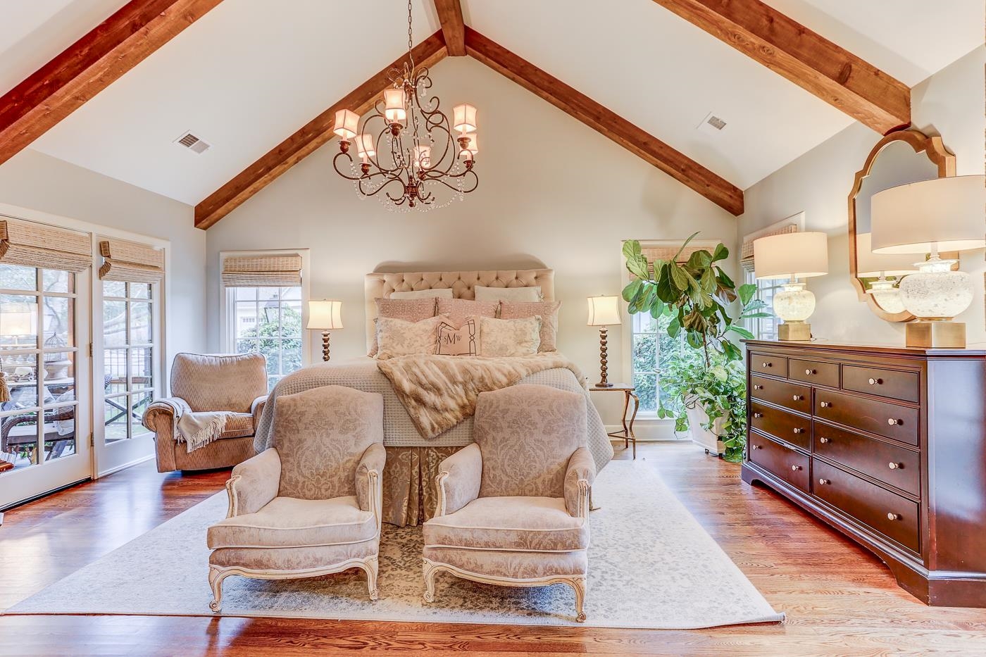 450 South Goodlett Street Memphis, TN 38117 - Photo 22 of 37 Bedroom featuring a chandelier, access to outside, light wood-type flooring, high vaulted ceiling, and beamed ceiling