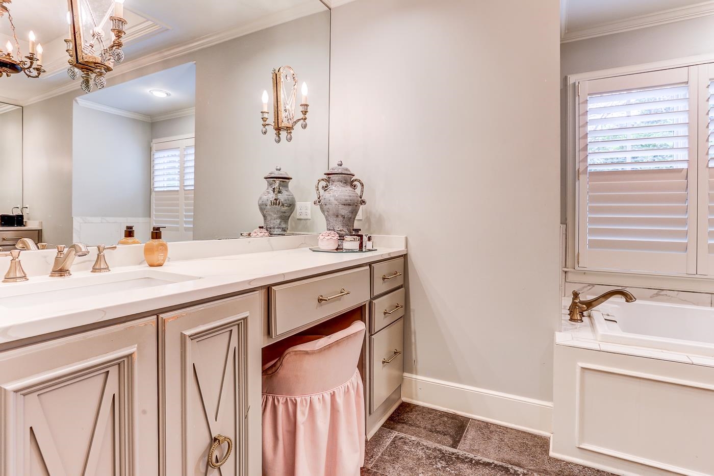 450 South Goodlett Street Memphis, TN 38117 - Photo 26 of 37 Bathroom featuring ornamental molding, vanity, a bath, and a chandelier