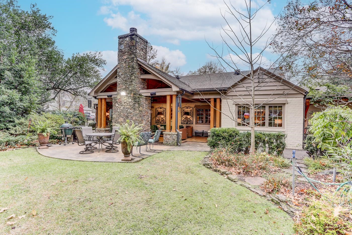 450 South Goodlett Street Memphis, TN 38117 - Photo 36 of 37 Rear view of property with a patio area, a lawn, a chimney, brick siding, and roof with shingles