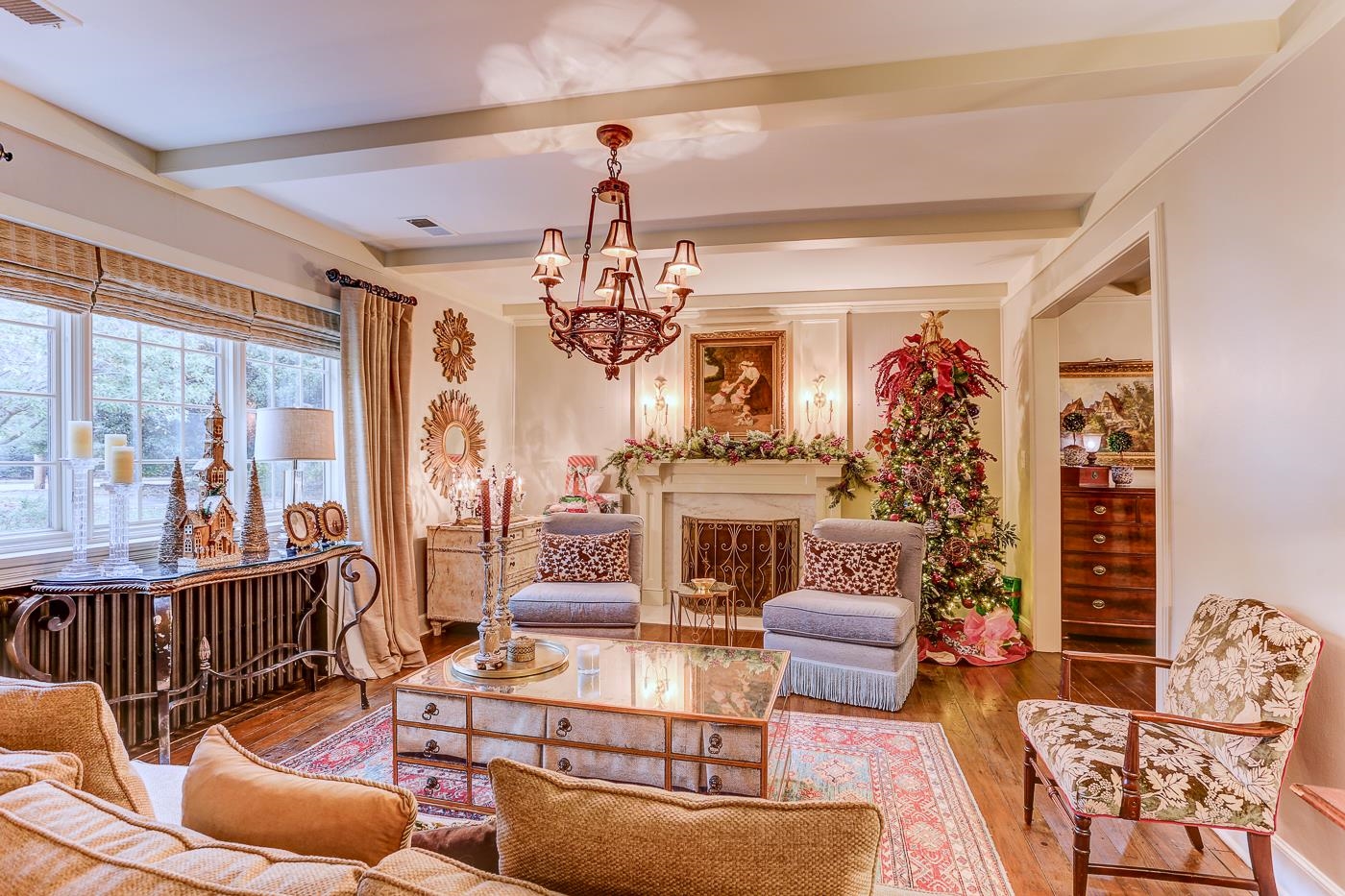 450 South Goodlett Street Memphis, TN 38117 - Photo 5 of 37 Living area featuring beamed ceiling, wood finished floors, a chandelier, and a fireplace