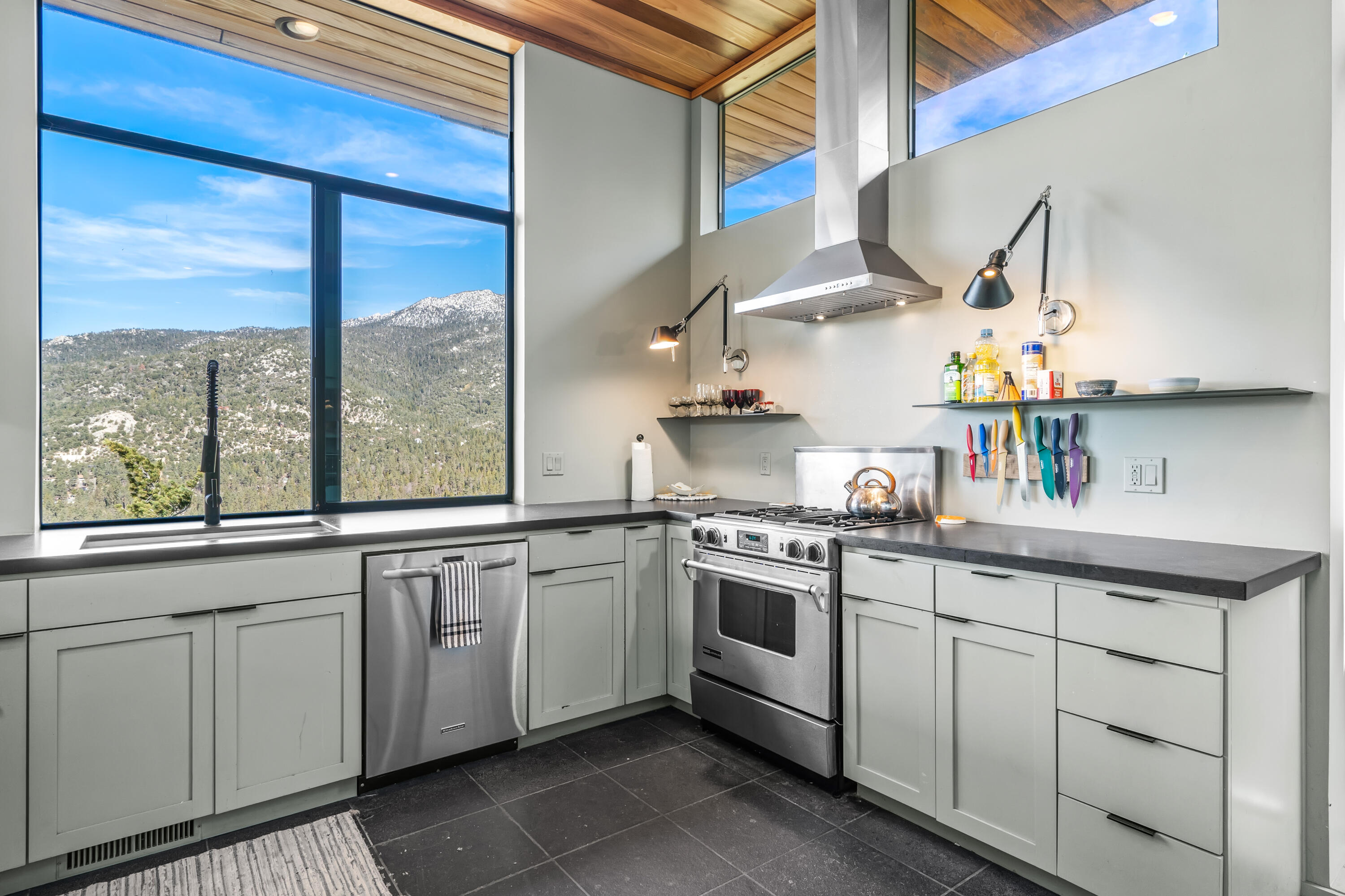 54685 Crest Drive Idyllwild, CA 92549 - Photo 21 of 50 a kitchen with a sink and a stove