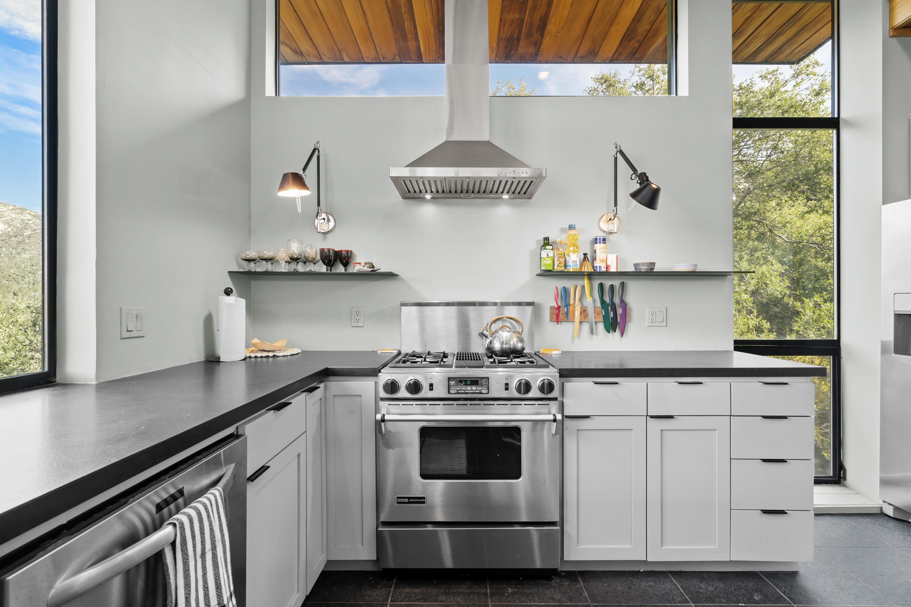 54685 Crest Drive Idyllwild, CA 92549 - Photo 22 of 50 a white stove top oven sitting inside of a kitchen
