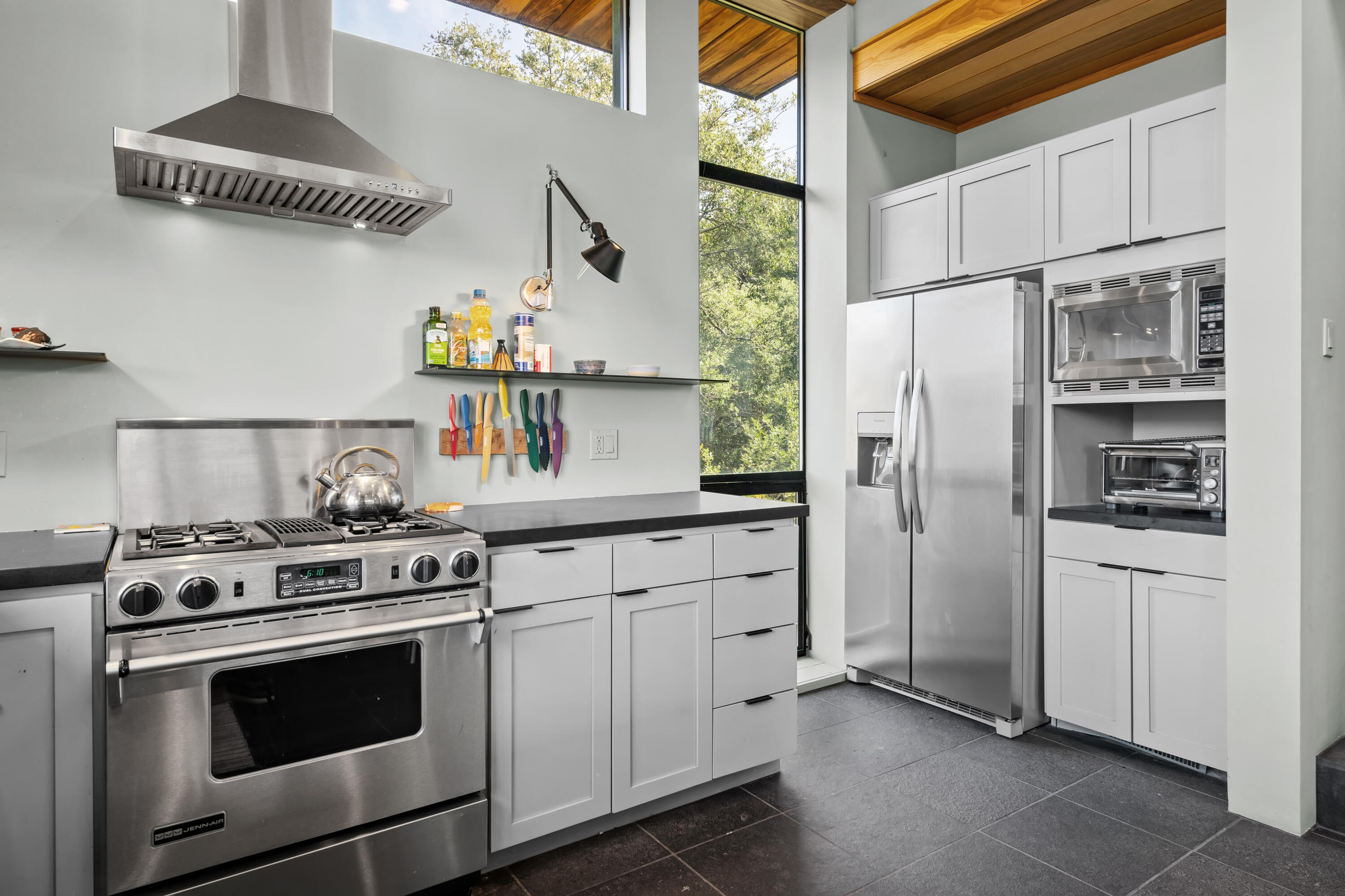 54685 Crest Drive Idyllwild, CA 92549 - Photo 23 of 50 a kitchen with white cabinets and white appliances