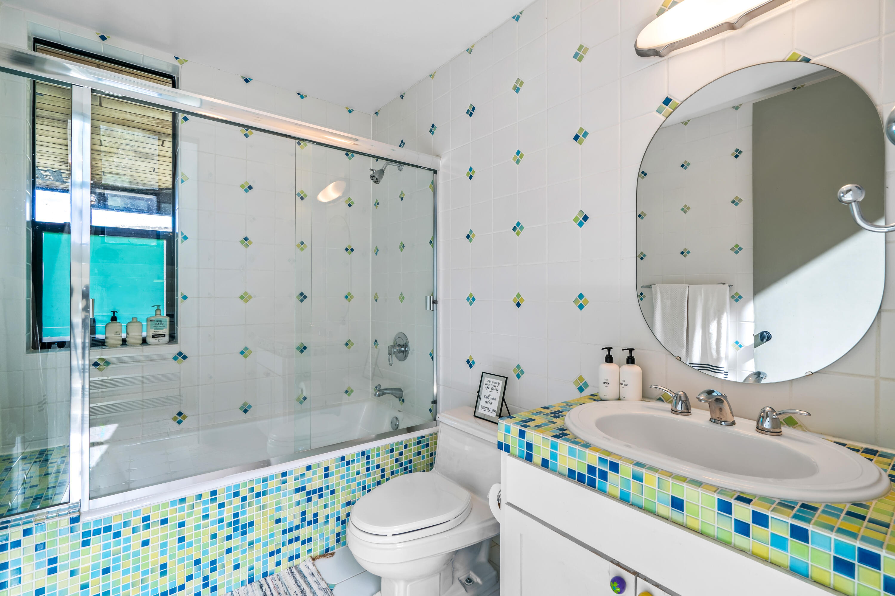 54685 Crest Drive Idyllwild, CA 92549 - Photo 32 of 50 a bathroom with a sink mirror vanity and toilet