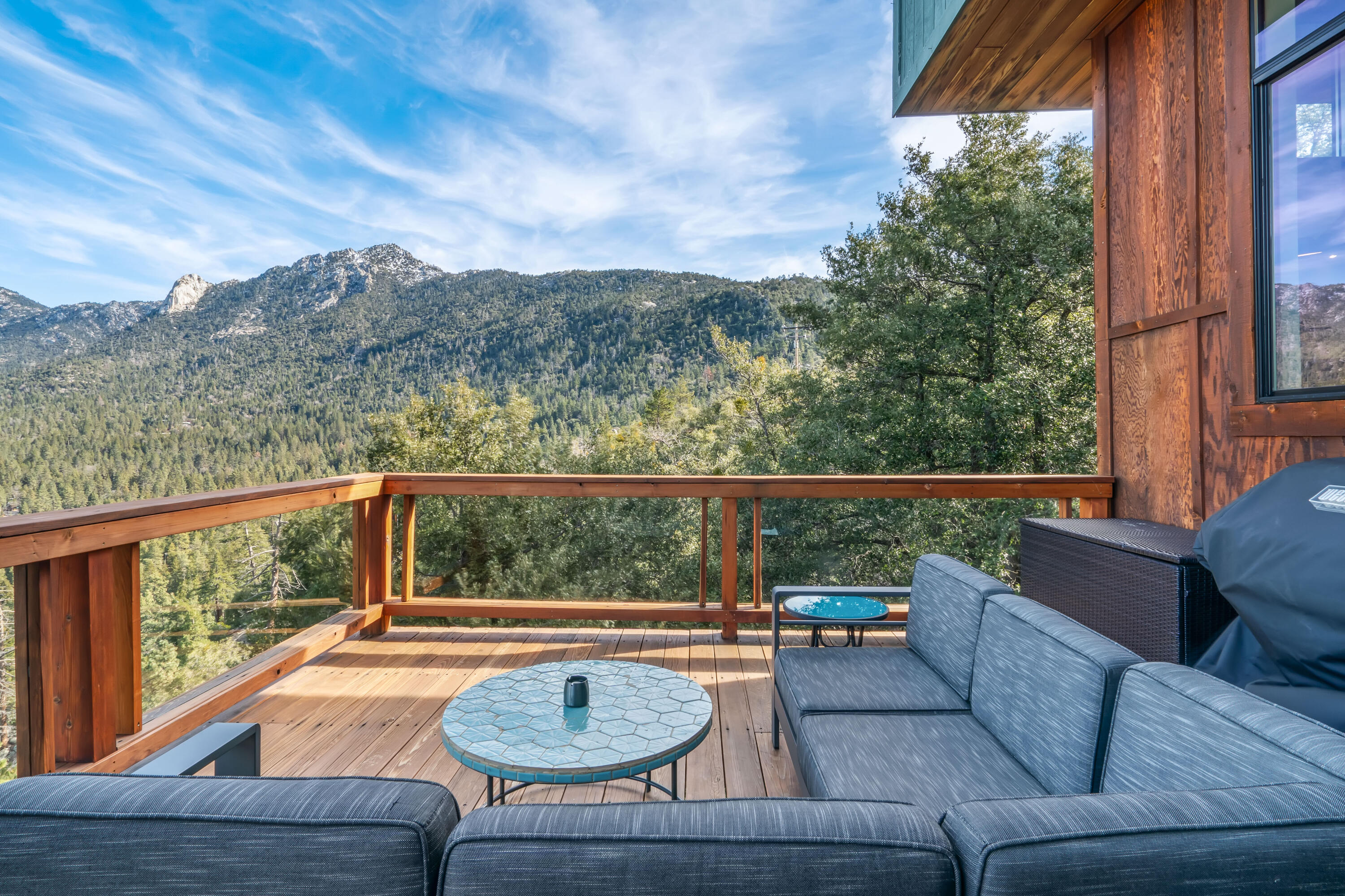 54685 Crest Drive Idyllwild, CA 92549 - Photo 40 of 50 a view of balcony with couches and wooden floor