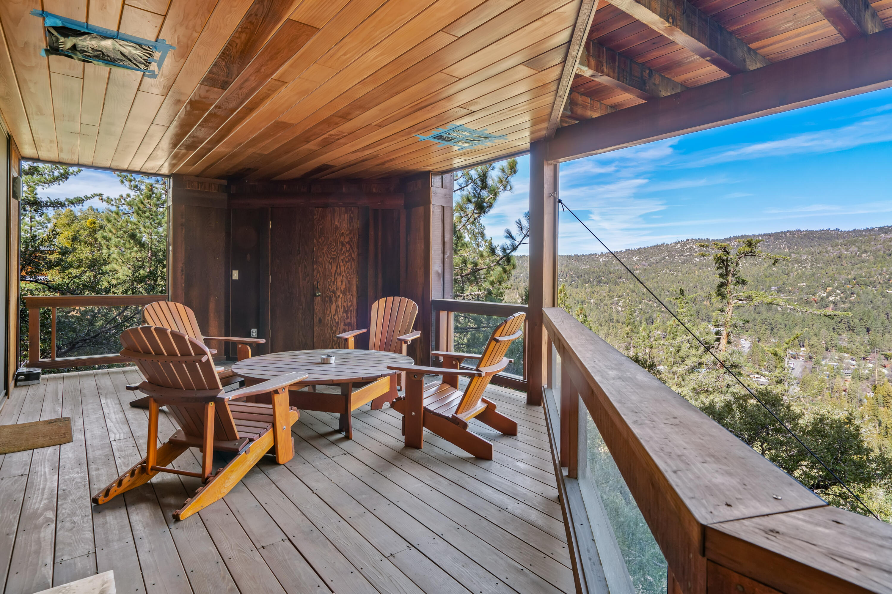 54685 Crest Drive Idyllwild, CA 92549 - Photo 44 of 50 a balcony with wooden floor and furniture