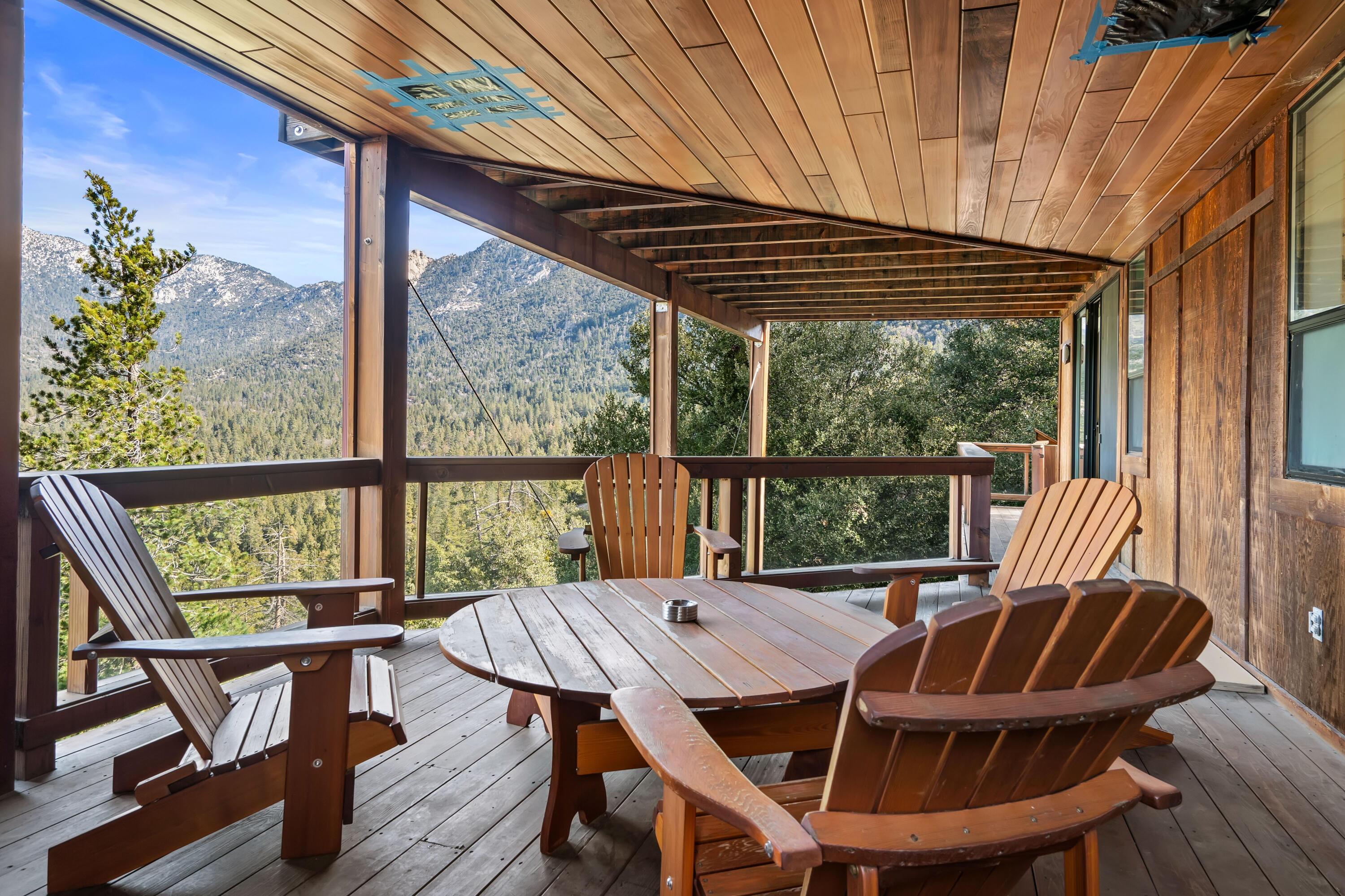 54685 Crest Drive Idyllwild, CA 92549 - Photo 46 of 50 a view of balcony with wooden floor and outdoor seating