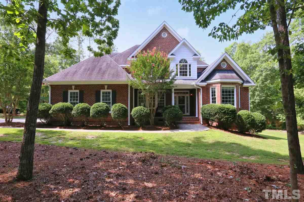 2621 Lizei Street Raleigh, NC 27616 - Photo 1 of 25 a front view of a house with a yard and garage