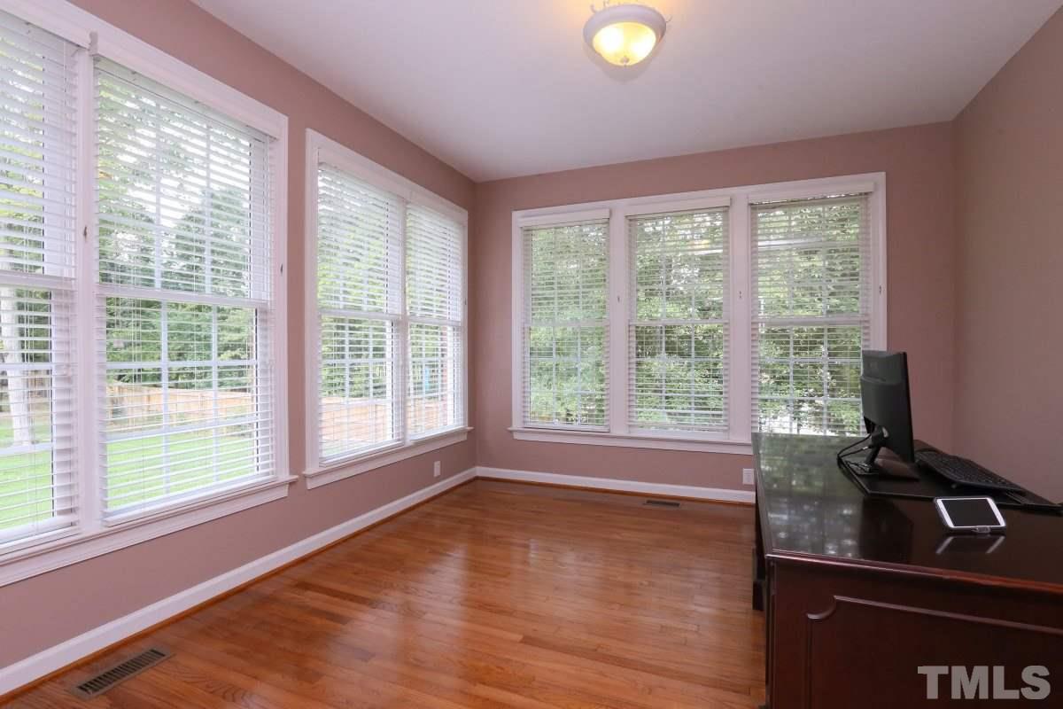 2621 Lizei Street Raleigh, NC 27616 - Photo 11 of 25 a view of empty room with wooden floor and fan