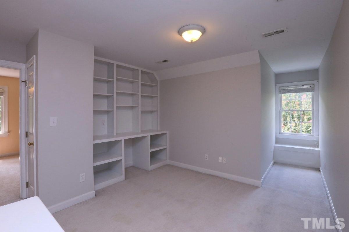 2621 Lizei Street Raleigh, NC 27616 - Photo 13 of 25 a view of an empty room with closet and racks