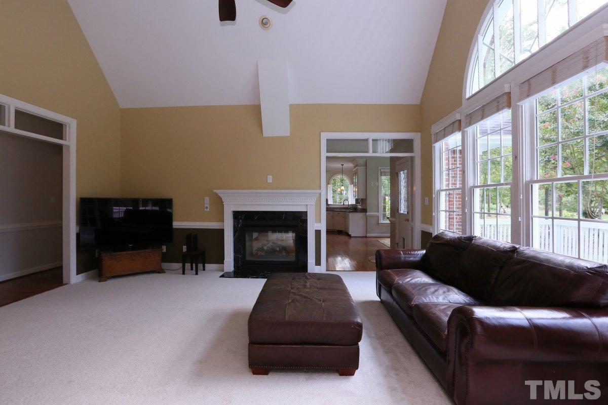 2621 Lizei Street Raleigh, NC 27616 - Photo 19 of 25 a living room with furniture and a fireplace