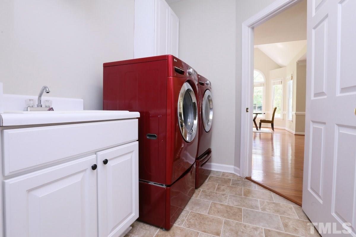 2621 Lizei Street Raleigh, NC 27616 - Photo 21 of 25 a utility room with dryer and washer
