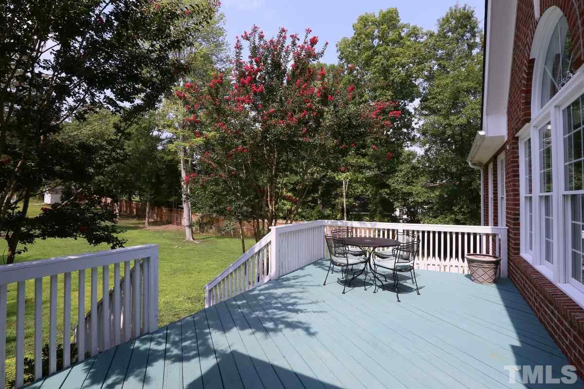 2621 Lizei Street Raleigh, NC 27616 - Photo 22 of 25 a view of a patio with a table and chairs