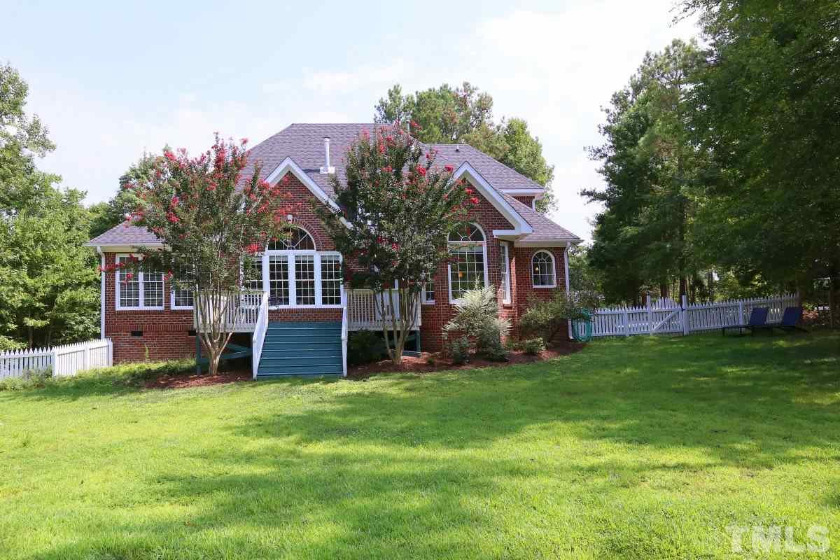 2621 Lizei Street Raleigh, NC 27616 - Photo 24 of 25 a front view of a house with a yard and trees