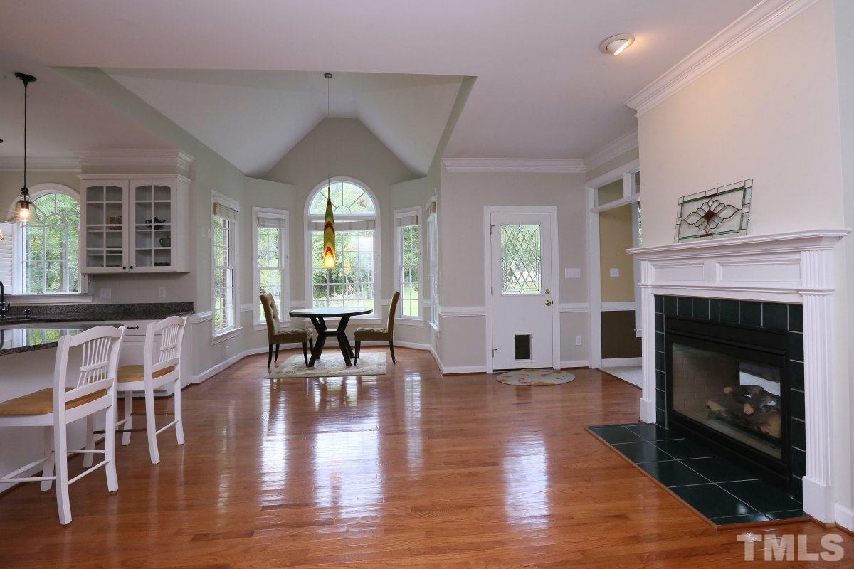 2621 Lizei Street Raleigh, NC 27616 - Photo 5 of 25 a living room with furniture a fireplace and a table
