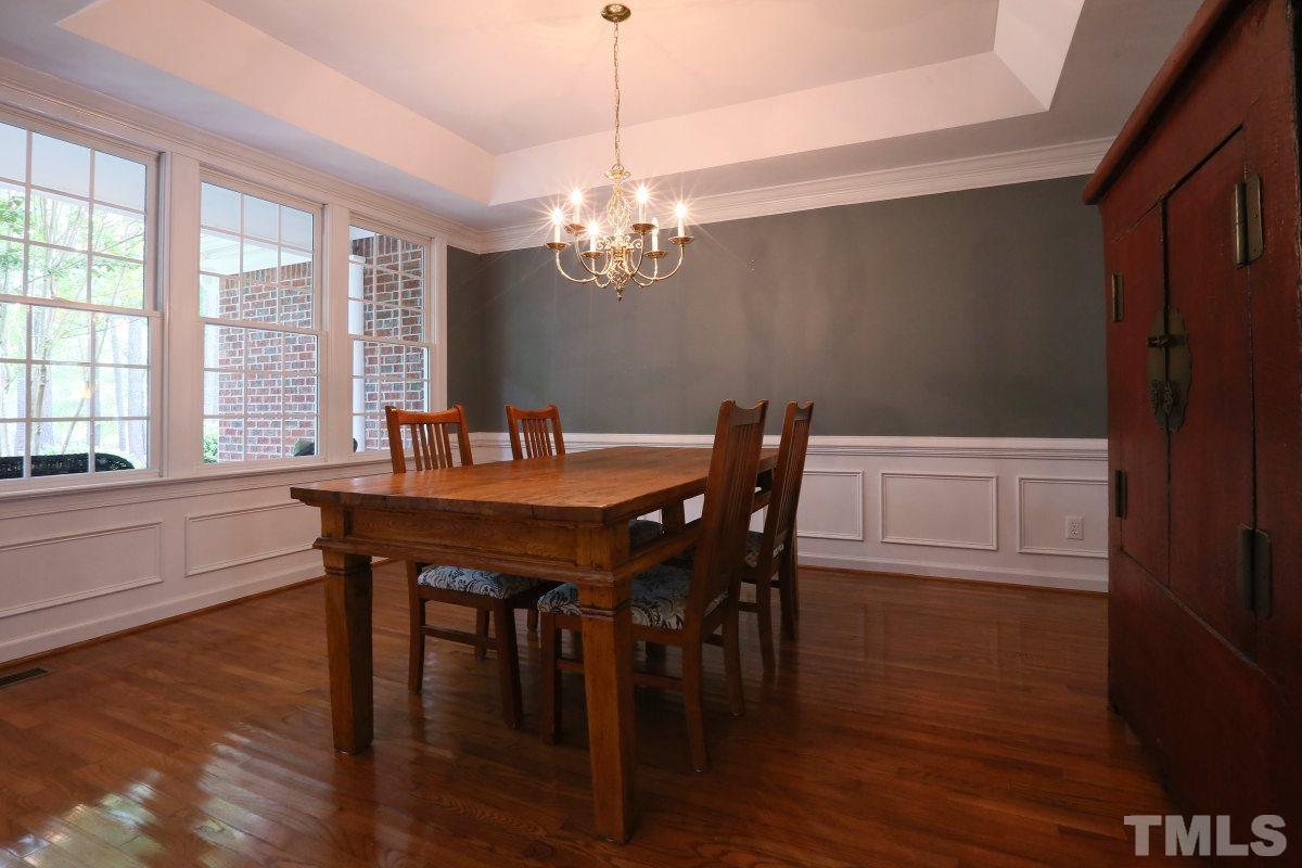 2621 Lizei Street Raleigh, NC 27616 - Photo 9 of 25 a view of a dining room with furniture window and wooden floor