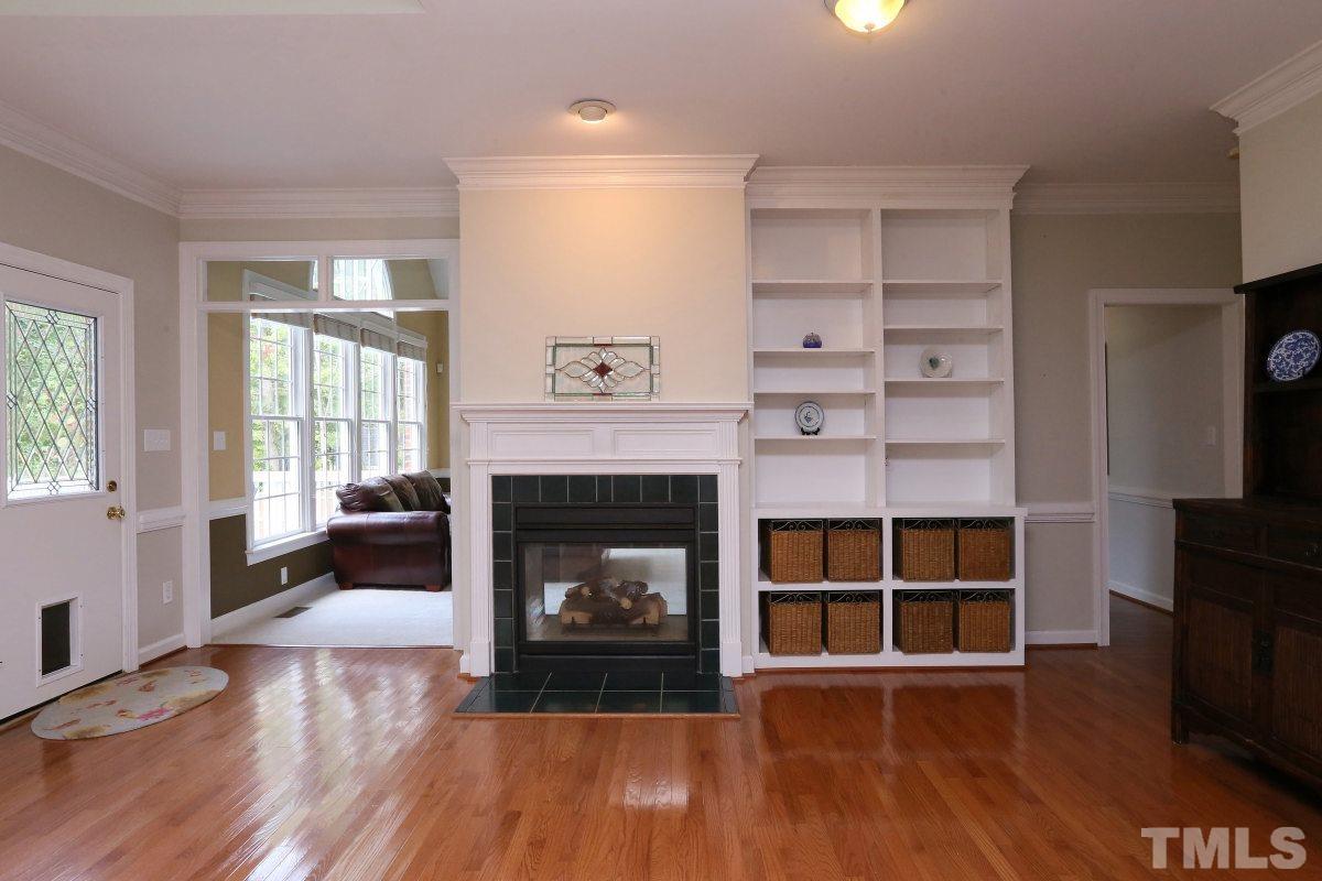 2621 Lizei Street Raleigh, NC 27616 - Photo 10 of 25 a living room with furniture and a fireplace