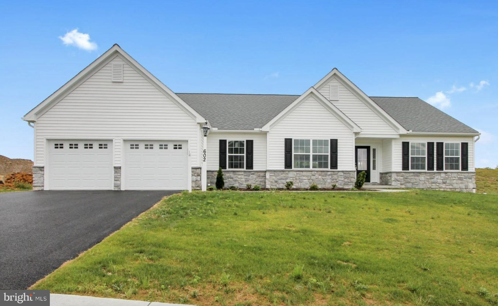 602 Rishel Drive York, PA 17406 - Photo 1 of 30 a view of a yard in front of a house with plants and large tree