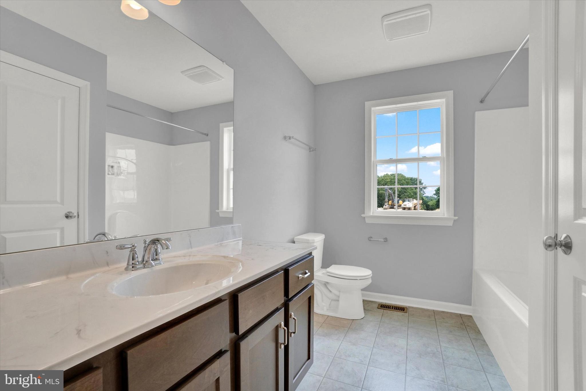 602 Rishel Drive York, PA 17406 - Photo 23 of 30 a bathroom with a sink a toilet a shower and a window