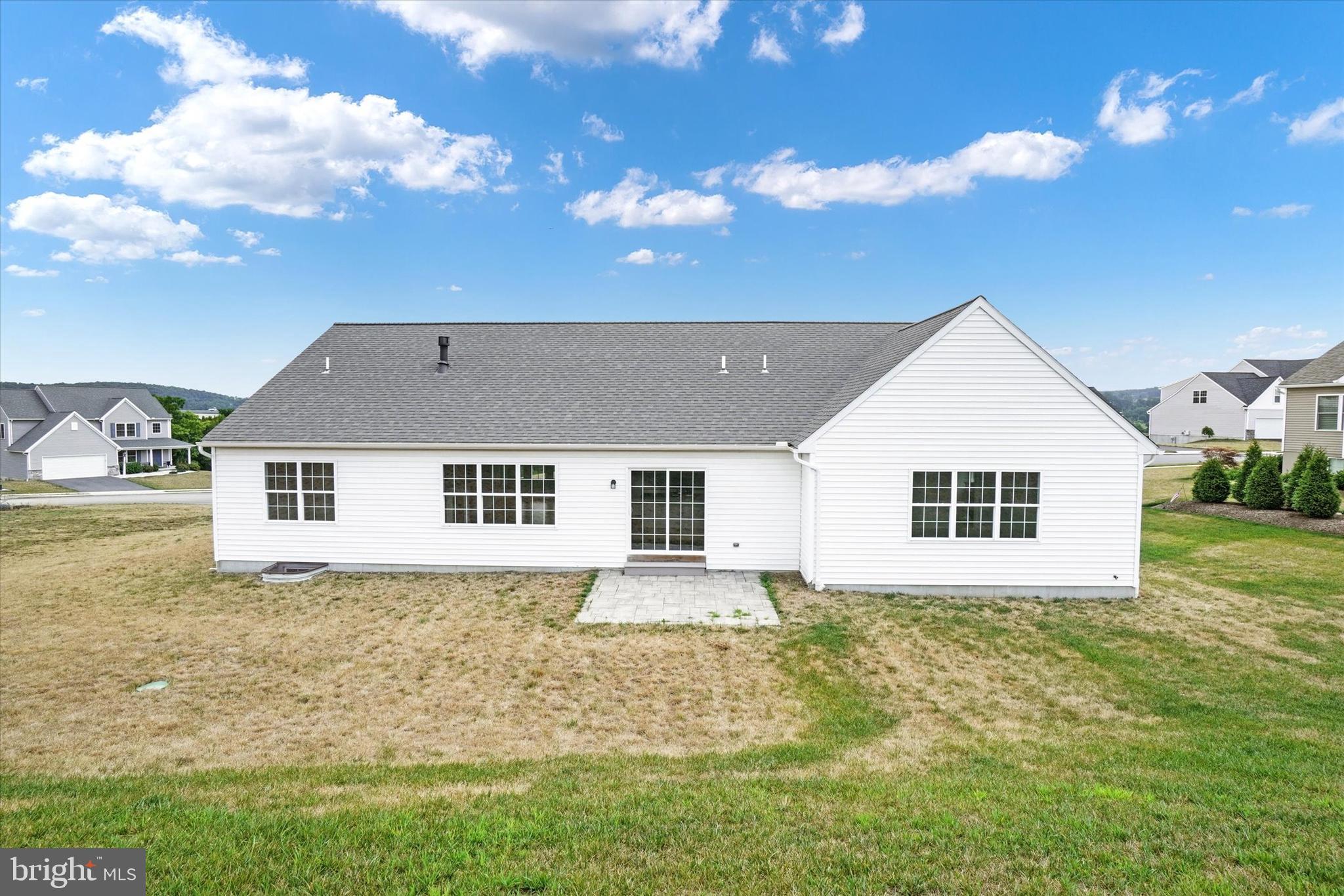 602 Rishel Drive York, PA 17406 - Photo 29 of 30 a front view of house with yard and trees in the background