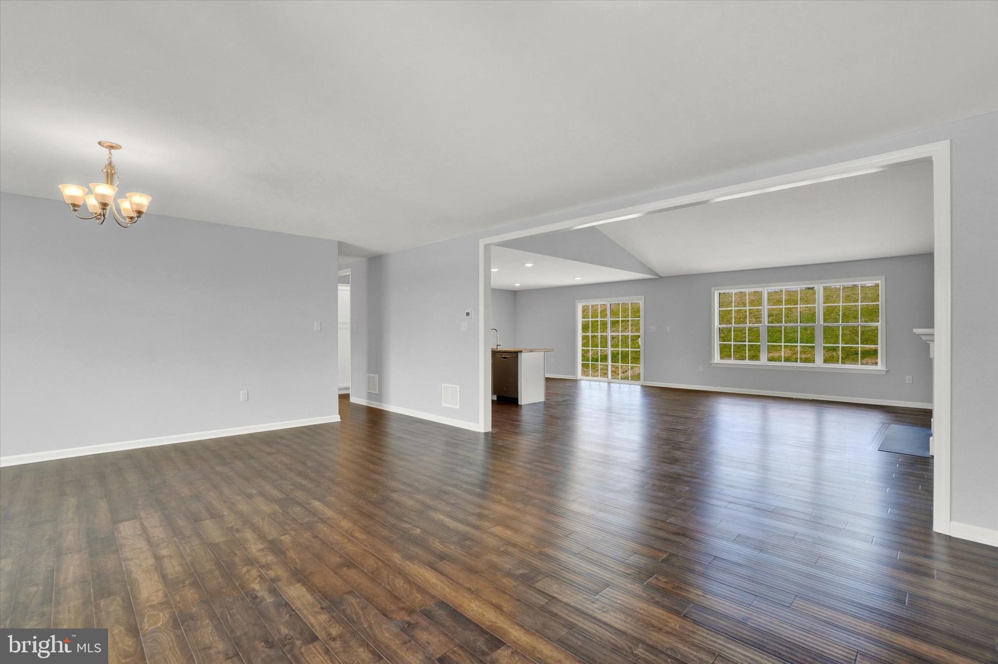 602 Rishel Drive York, PA 17406 - Photo 4 of 30 a view of an empty room with window and wooden floor