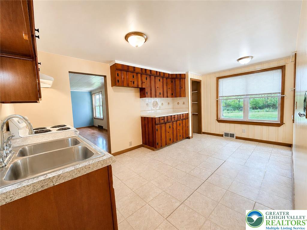 4995 Mountain Road Slatington, PA 18080 - Photo 8 of 30 A functional kitchen space featuring ample cabinetry and a practical sink area.